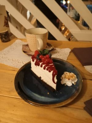 Cheesecake with raspberry sauce at Romeow Cat Bistrot in Rome