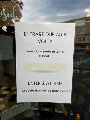 Funny sign at the entry to keep cats in   at Romeow Cat Bistrot in Rome