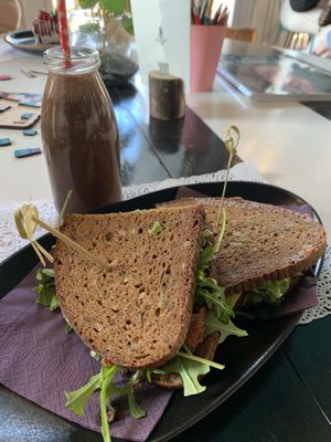 Almond, banana & cocoa smoothie. Avocado & pesto rye sandwich (it was excellent!)  at Romeow Cat Bistrot in Rome