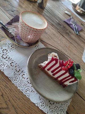 Hazelnut Milk Coffee and Cheesecake 🫐 at Romeow Cat Bistrot in Rome