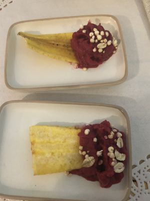 Complementary welcome appetizer. I believe it was a plantain(?) chip with beetroot hummus.  at Romeow Cat Bistrot in Rome