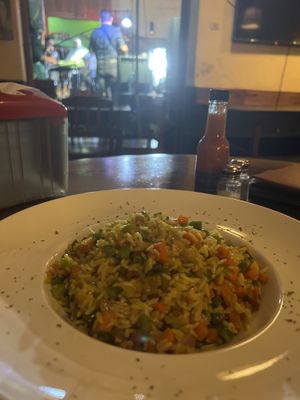 Arroz con vegetales with a view of the band! Awesome place   at ViaVia in Leon