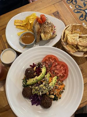 Cauliflower steak sanga & falafel rainbow salad  at Ikaro Cafe in Santa Marta