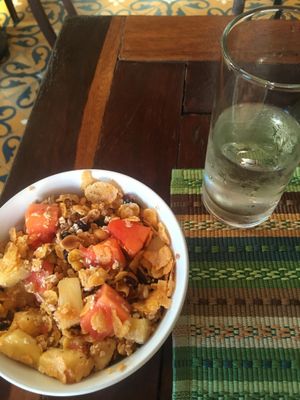 Homemade granola and cereal with fruits and almond milk   at Ikaro Cafe in Santa Marta