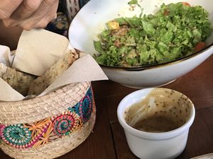 Our half eaten salad and bread   at Ikaro Cafe in Santa Marta
