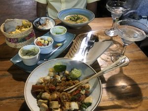Pad Thai (partly eaten), the African Chickpea Curry and Margaritas. All fabulous! Plus platter starter. at Ikaro Cafe in Santa Marta