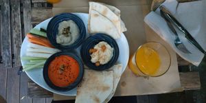 Hummus, baba ganoush and muhammara. at Kafe Botanika in San Sebastian