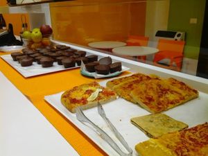 Vegan pizza and chocolate muffins  at Re Vegano in Reggio Emilia
