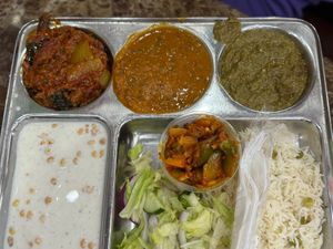 Eggplant Bhartha, Saag and Okra and Rice are vegan. Daal Makni and Yogurt is not in this thaali   at Prem Sweets and Restaurant in Brampton