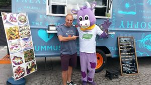 with HappyCow mascot at the Vegan Oktoberfest at Falasophy - Food Truck in Anaheim