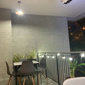  Outdoor seating at night  at Chana Plant Based in Medellin