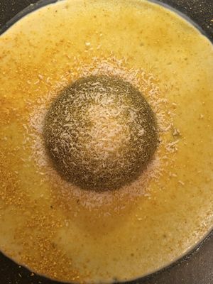 Saturno: a nutty heart in a dark chocolate semisphere and orange cream  at Al Tiglio Cucina Naturale in Moruzzo