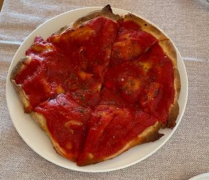 Vegan focaccia with tomatoes sauce   at Al Tiglio Cucina Naturale in Moruzzo