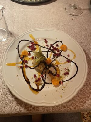 Halva with chocolate and caramel sauce, pomegranate, physalis and pistachios  at Al Tiglio Cucina Naturale in Moruzzo