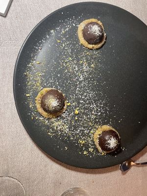 Bounty - coconut almond balls with chocolate and date salted caramel  at Al Tiglio Cucina Naturale in Moruzzo