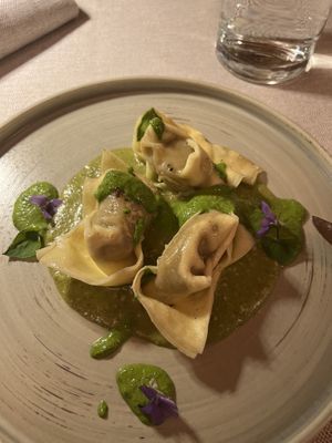 Mushroom raviolis with two different pesto-like sauces   at Al Tiglio Cucina Naturale in Moruzzo