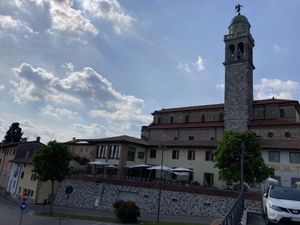 The white umbrellas show the restaurant, shot from free parking lot across the street.   at Al Tiglio Cucina Naturale in Moruzzo