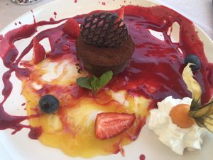 Cremino: Cocoa and hazelnuts, red fruits cream, orange cream at Al Tiglio Cucina Naturale in Moruzzo