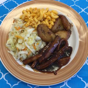 Jerk chicken, mac and cheese, plantains, and cabbage... at Just 4 U Vegan Market in Fitzgerald