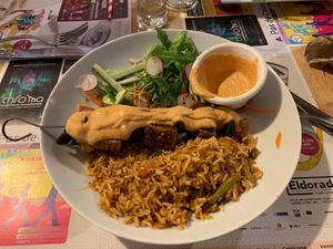 Fried tofu and mushroom with satay sauce, Indonesian fried rice and salad at Mezzaluna in Saint-laurent-blangy