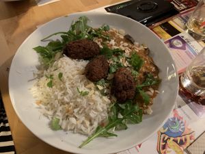 Korma curry with vegetable koftes and basmati rice at Mezzaluna in Saint-laurent-blangy