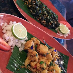 kale and chickpeas & aloo hobo at New India Cuisine in Austin