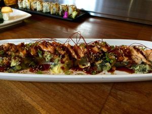 Boddy and Soul Roll (tempura fried roll with spicy bean curd, tapioca, negi, ito togarashi, sesame, red chili sauce). at Shizen Vegan Sushi Bar in San Francisco