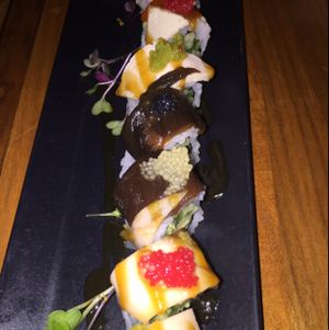 proud peacock: cucumber, avocado, shiitake, eggplant, tofu, pickled mango, roasted peppers, and seaweed pearls. (gluten free) $14.95 at Shizen Vegan Sushi Bar in San Francisco