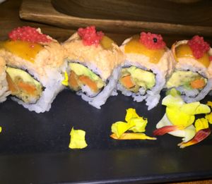scarlet smile: sweet potato tempura, avocado, spicybean curd, roasted red pepper, and seaweed pearls. $13.80 at Shizen Vegan Sushi Bar in San Francisco