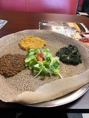 #19, yellow lentil, and kale potato - comes with the salad and the bread which you eat the sides with  at Kibrom's in Boise
