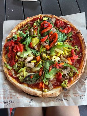 Vegan pizza with label and a ton of veggies at Blaze Pizza in Gainesville