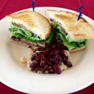 Jamaican style Tempeh, Lettuce, and Tomato sandwich with rice and beans.  at Quickie Too in Tacoma