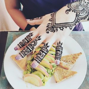 Avocado toast with freshly done Henna at Marrakech Henna Art Cafe in Marrakech