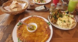 Lentil crepe, salad sampler (houmous, cucumber salad and zaaloush). at Marrakech Henna Art Cafe in Marrakech