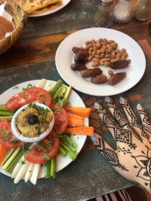 Hummus & raw veg plate, almonds and dates and henna  at Marrakech Henna Art Cafe in Marrakech