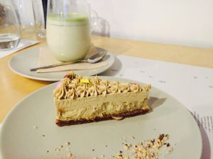 cheese cake and matcha almond milk at Mantra Raw in Milan