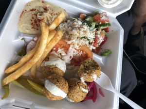 Falafel plate with Lebanese salad, hummus, and fries (and stole some rice from my husbands plate!) at D's Mediterranean Grill in Waco