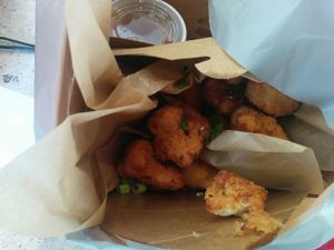 panko breaded cauliflower, served with an orange dipping sauce. OK, yet could have used for spices for flavor in the breading.   at Veggie Grill in Walnut Creek