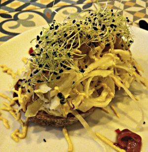 Toast with sauted cabbage, roasted onions and sprouts at VEGA - Luna in Madrid