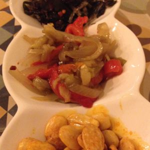 Three starters- (top to bottom) the seaweed salad, roasted veg, and paprika almonds  at VEGA - Luna in Madrid
