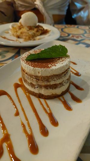 Tiramisu (Apple crumble in the background) at VEGA - Luna in Madrid