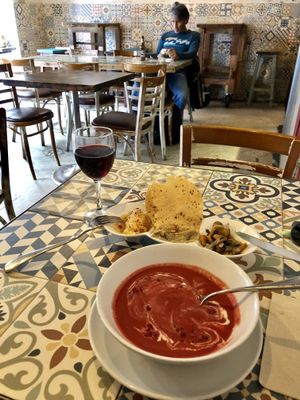a very flavourful beetroot and strawberry gazpacho, aperitifs and red wine  at VEGA - Luna in Madrid