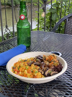 Yum, Yum, Gimme Some - coconut curry chickpea and vegetable bowl topped with mushrooms and kimchi over quinoa at The Clean Plate Kitchen in Clinton