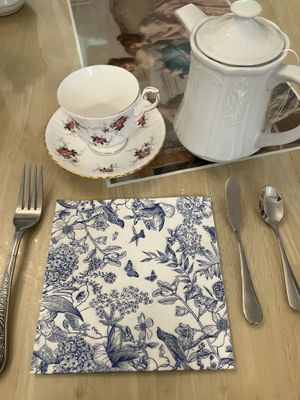 Adorable place setting with a pot of the Queen’s rose garden black tea  at Muir's Tea Room in Sebastopol