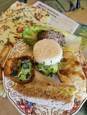 Muir's Holoholo Tiki Tea Service: Teriyaki Tofu & Veggie Puff Pastry Dumpling, Cucumber Tea Sandwich w/ chives,  Lettuce Cup w/ Mushroom filling, Chickpea "tuna" salad finger sandw at Muir's Tea Room in Sebastopol
