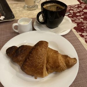 Apricot croissant and americano with cream  at Edeni Vegan in Budapest