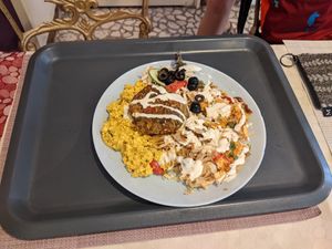 Veg patty, tofu scramble, sauerkraut, salad at Edeni Vegan in Budapest