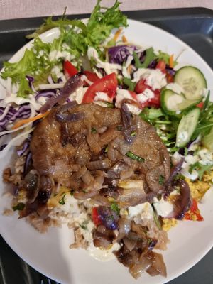 Seitan, tofu scramble and layered cauliflower with salad at Edeni Vegan in Budapest