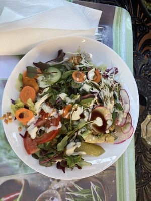 Some layered baked dish, covered with veggies  at Edeni Vegan in Budapest