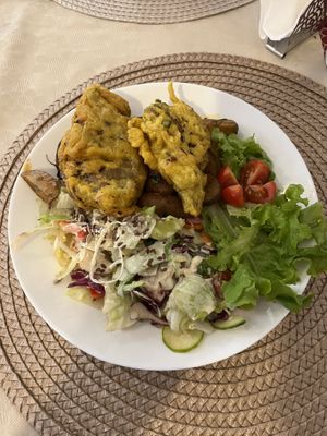 fried seitan with potatoes and side coleslaw and salad  at Edeni Vegan in Budapest